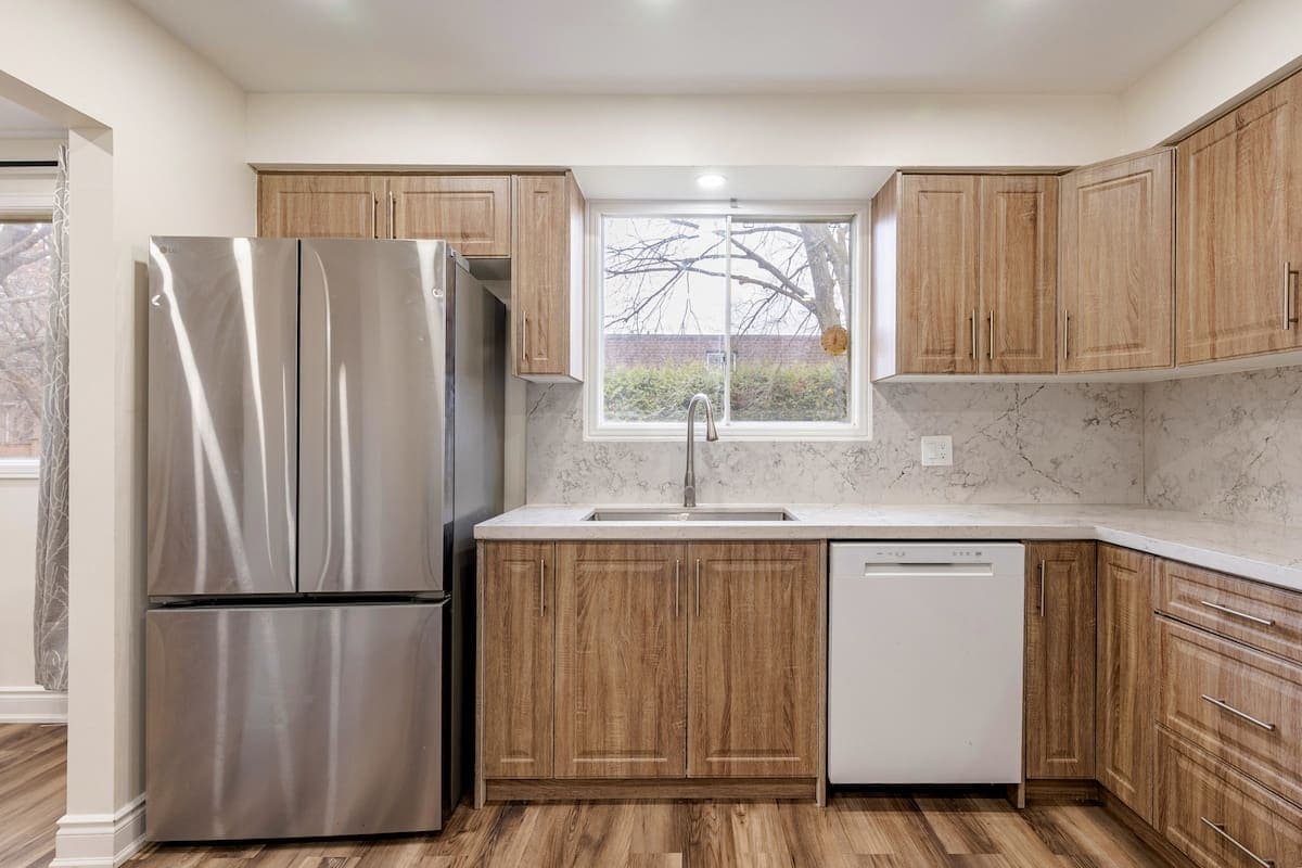 Full kitchen with stainless steel appliances in a Waterloo furnished rental, for cooking on a longer stay